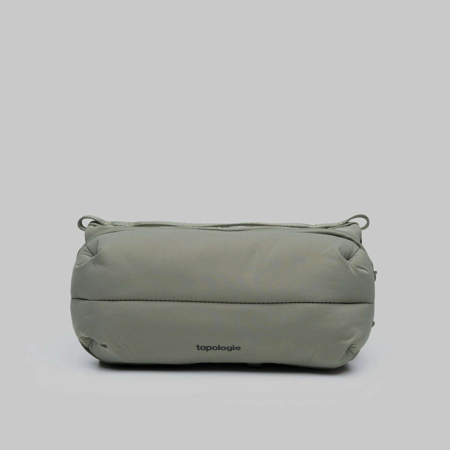 Bottle Sacoche Medium Moss Silky Peach Bag in water repellent recycled nylon, featuring zipped compartments.