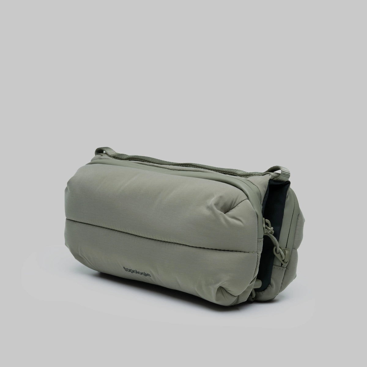 Bottle Sacoche Medium Moss Silky Peach Bag in soft green fabric with compartments for bottles and umbrellas.
