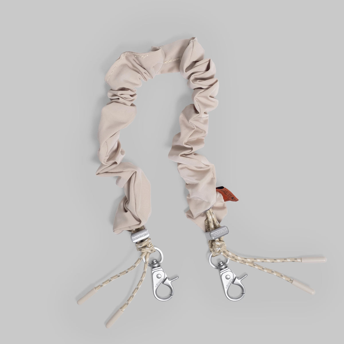 Bungee Wrist Strap Warm Sand Tech Sateen lightweight adjustable strap with quick release clasp.