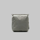 Cassette Sacoche Medium Moss Tech Sateen Bag in gray with zippered compartments and adjustable straps.