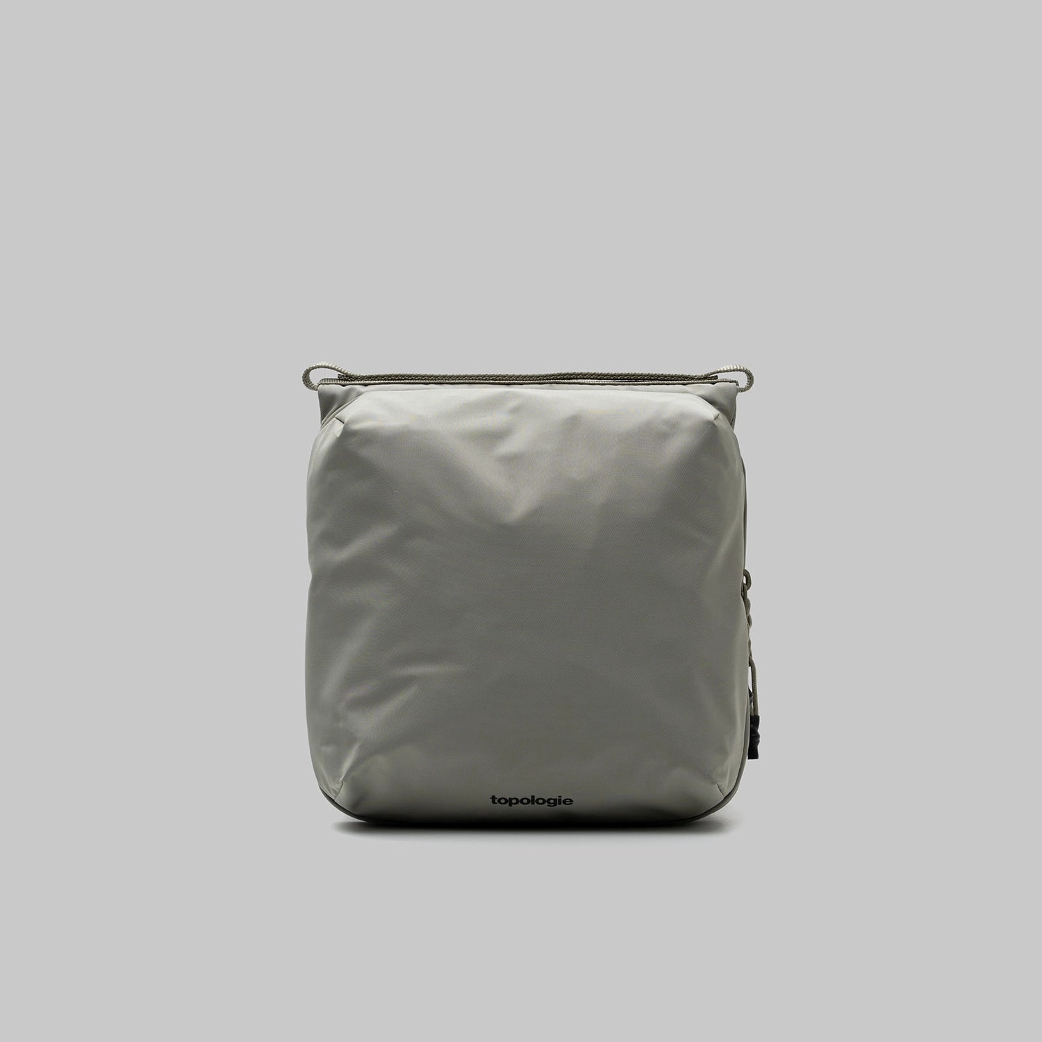 Cassette Sacoche Medium Moss Tech Sateen Bag in gray with zippered compartments and adjustable straps.