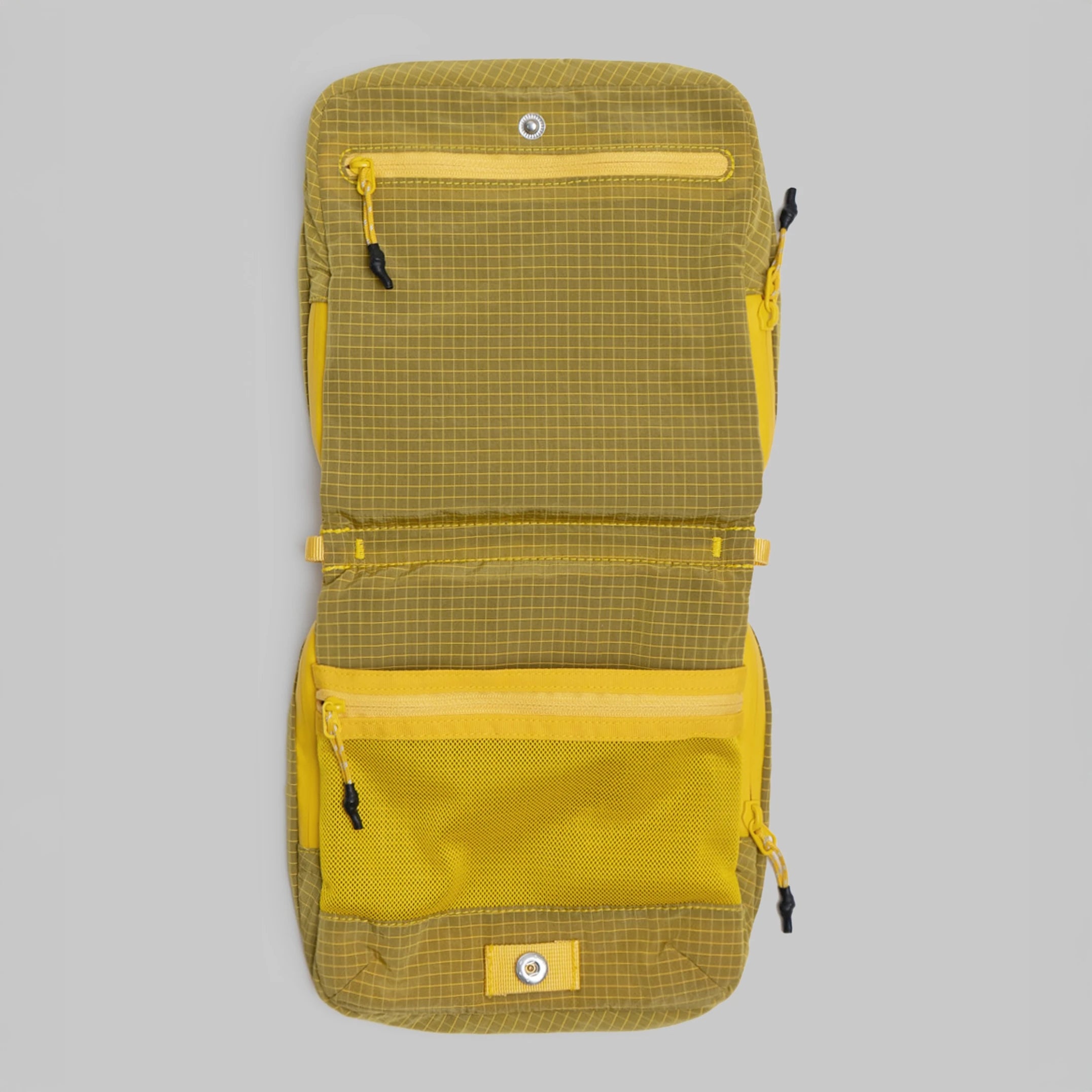 Cassette Sacoche Medium Mustard Vintage Ripstop Bag open showing zippered compartments and mesh pockets.