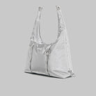 Cloud Hobo Small Chrome Space Coated Shoulder Bag on gray background, showcasing zipped main compartment and drawstring design.