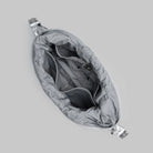 Inside view of the Cloud Hobo Small Chrome Space Coated Shoulder Bag showing zippered compartment and pockets.