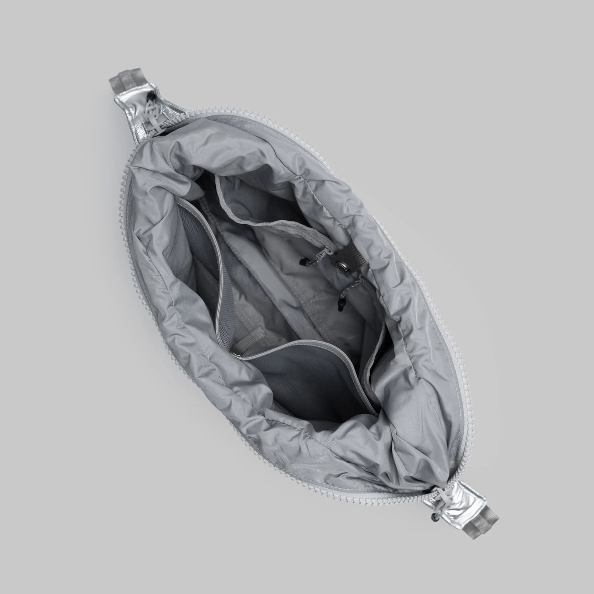 Inside view of the Cloud Hobo Small Chrome Space Coated Shoulder Bag showing zippered compartment and pockets.
