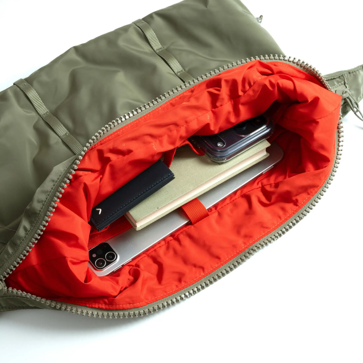 Interior view of Cloud Hobo Small Chrome Space Coated Shoulder Bag showcasing organizational pockets and vibrant lining.