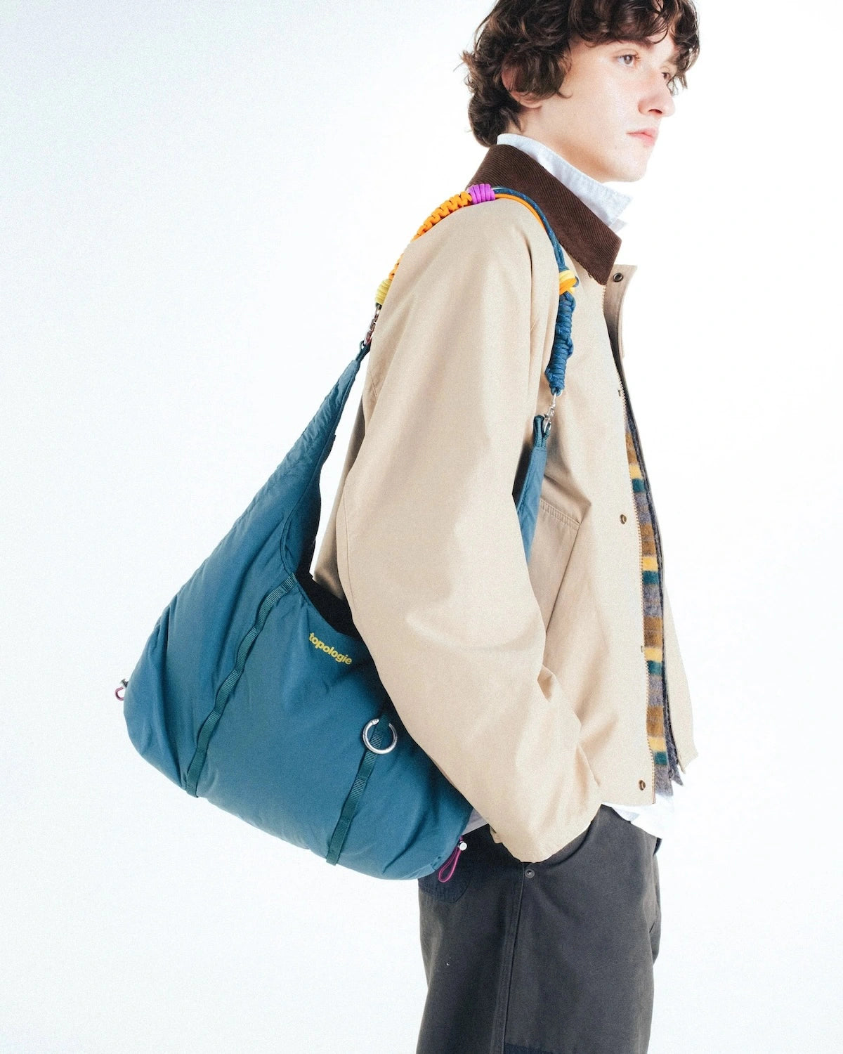Cloud Hobo Small Chrome Space Coated Shoulder Bag being worn casually with stylish outfit.