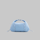 Cloud Hobo XS Chambray Silky Peach Shoulder Bag in light blue color with unique design and drawstring details.