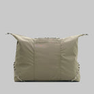 Explorer Tote Weekender Moss Tech Sateen Shoulder Bag in a neutral tone featuring a unique design and spacious interior.