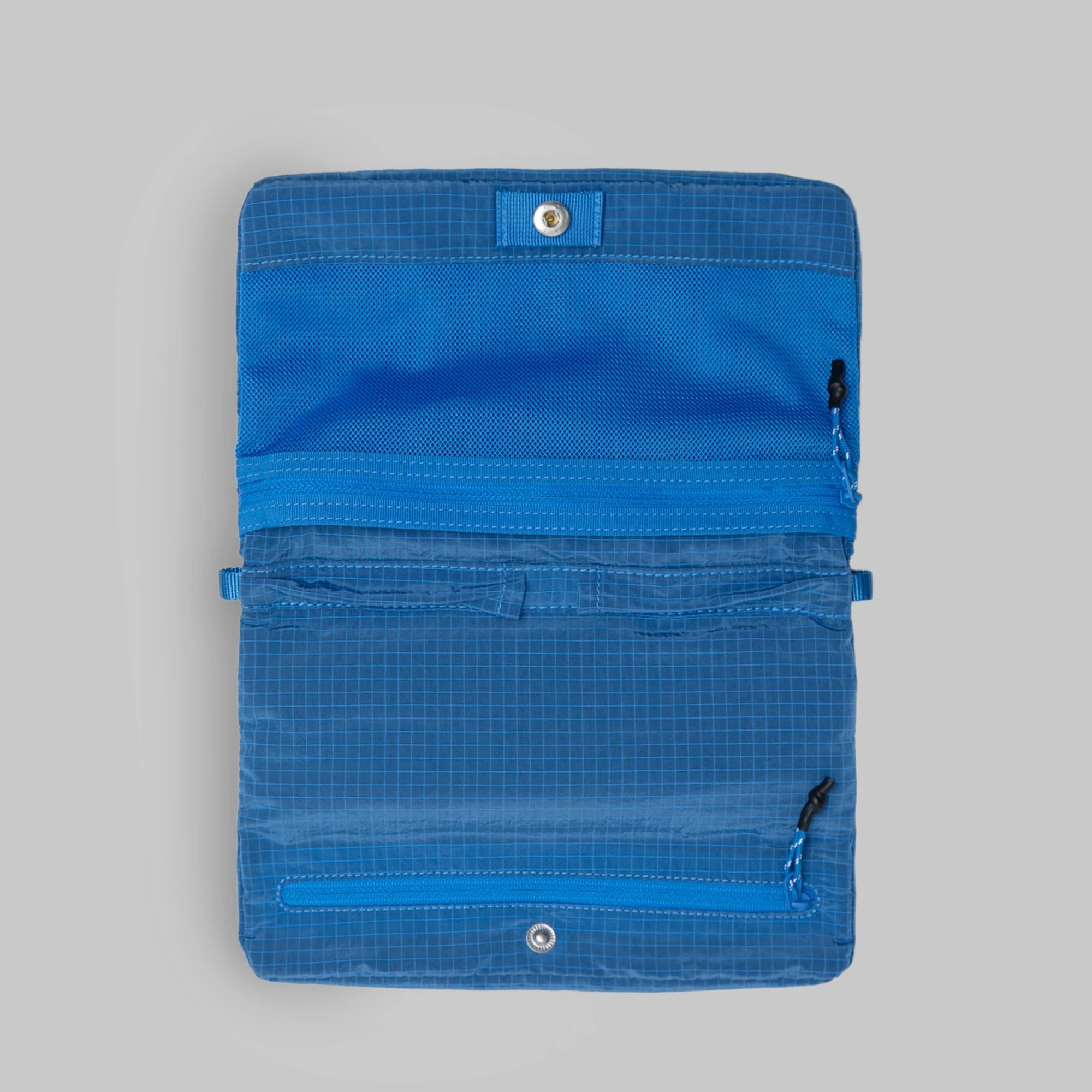 Flat Sacoche Small Sonic Vintage Ripstop Bag interior view with zipped compartments and blue fabric.