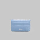 Phone Sacoche 90 Chambray Silky Peach Bag in light blue with zip compartments and Topologie branding.