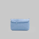 Phone Sacoche 90 Chambray Silky Peach Bag in light blue color with soft padding and zipper.