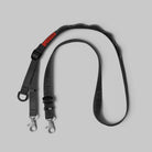 Utility Sling Black Strap with adjustable length and heavy-duty clasp for secure hold.
