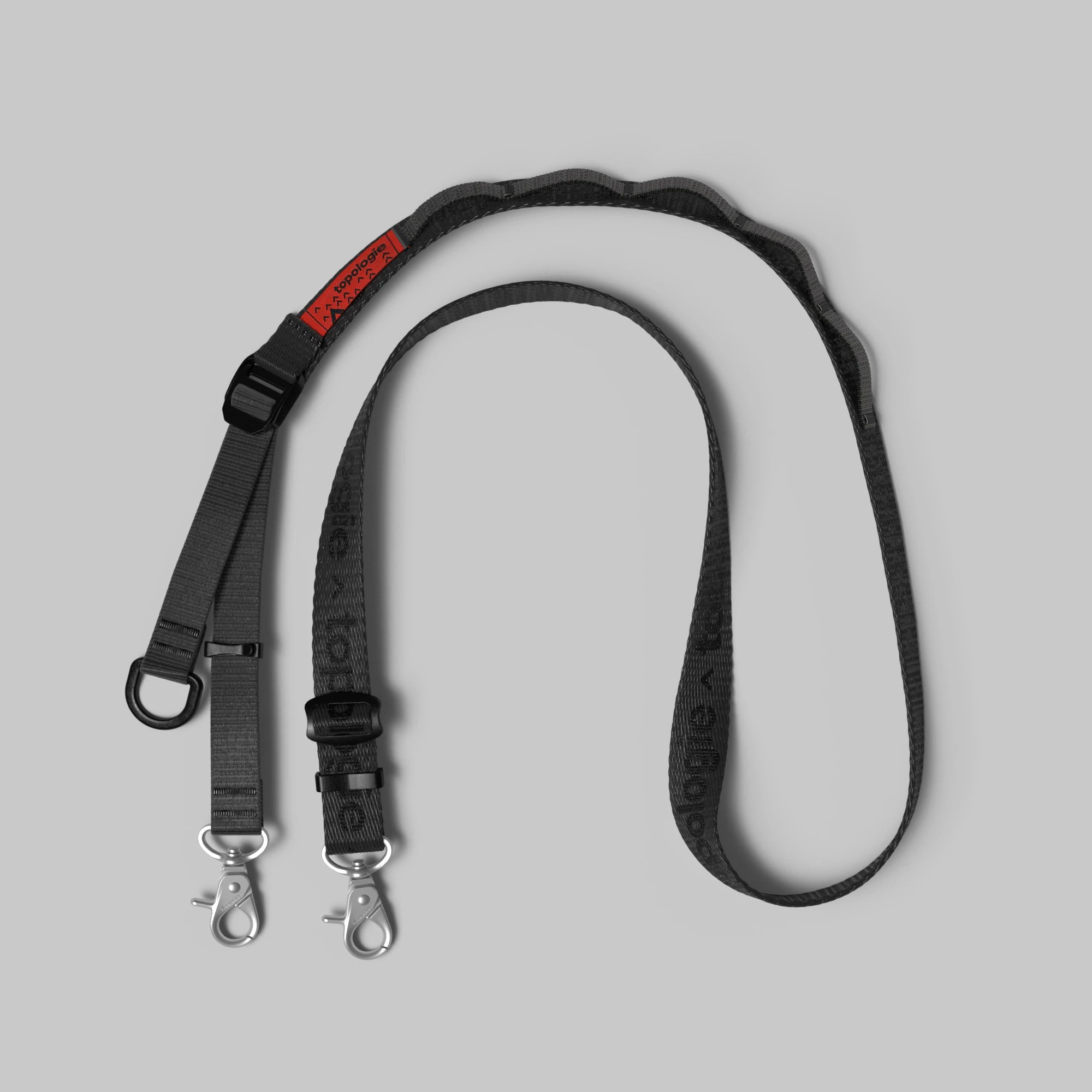 Utility Sling Black Strap with adjustable length and heavy-duty clasp for secure hold.