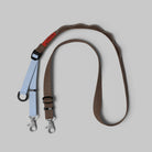 Utility Sling Cocoa Strap featuring adjustable lengths and durable nylon material.