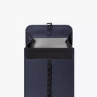 Kumo Medium Lotus Infinity Dark Navy Backpack interior view showing waterproof material and magnetic closure