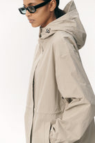 Roomy Long Tube Nylon Light Army Coat with adjustable hood and lightweight design