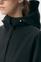 Roomy Long Tube Nylon Navy Coat featuring an adjustable hood and sleek design for comfort.