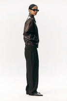 Short Tracker WM Dark Chocolate Jacket worn by model, showcasing a sleek dark design with a comfortable fit.