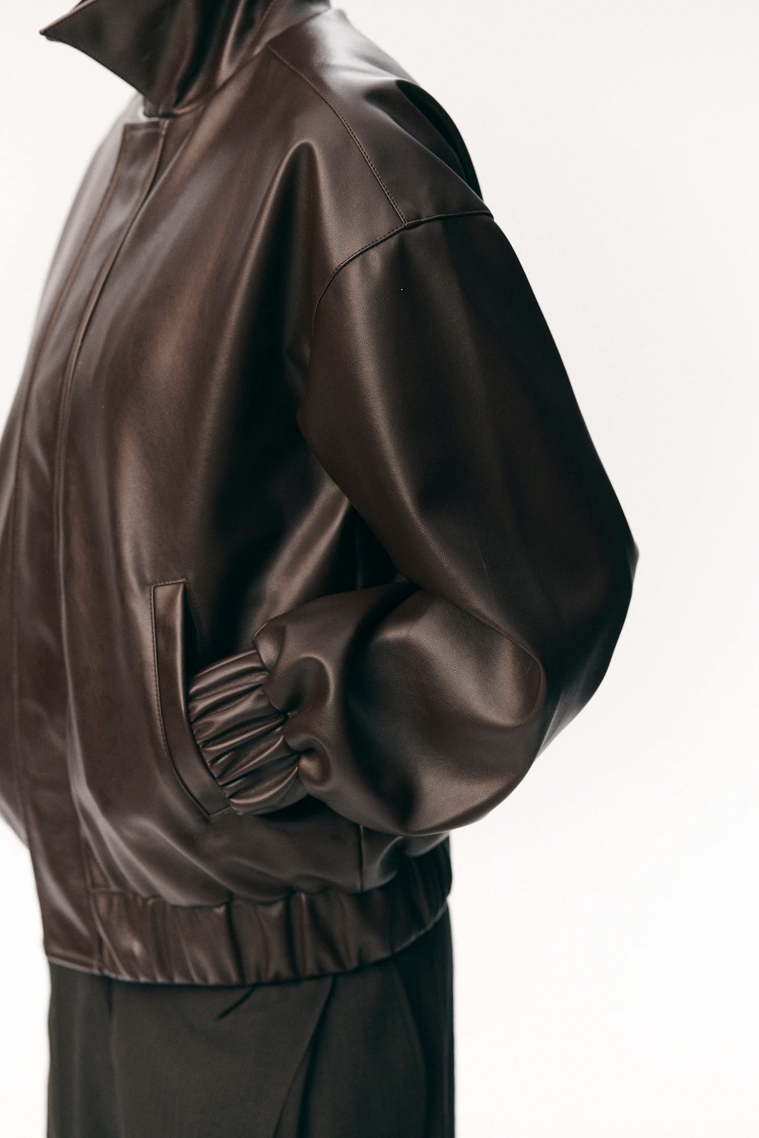 Short Tracker WM Dark Chocolate Jacket side view showcasing faux leather and elastic waistband.