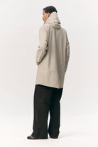 Model wearing the Terror Weather Nylon Light Army Coat from the back, showcasing its lightweight and stylish design.