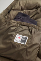 Arctic Parka Dark Green Coat interior with Ramar Cloth label and inner pocket showing premium quality construction.