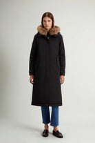 Best Cotton Faux Fur Parka Black Coat worn by a model with a faux fur-lined hood.