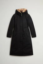 Best Cotton Faux Fur Parka Black Coat with removable faux fur hood and side pockets.