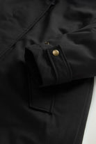 Close-up of adjustable sleeve cuff on Best Cotton Faux Fur Parka Black Coat, showcasing snap button detail.
