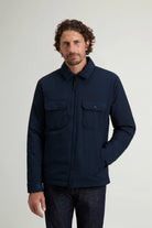 Cloud Overshirt Melton Blue worn by a man, featuring a two-way zipper and chest pockets.