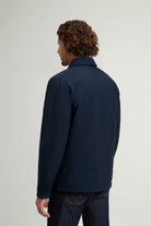 Back view of a man wearing the Cloud Overshirt Melton Blue, showcasing its stylish design and versatile functionality.