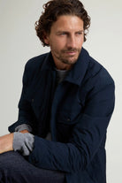 Model wearing the Cloud Overshirt Melton Blue, showcasing its stylish design and functional features.