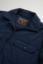 Cloud Overshirt Melton Blue close-up showing collar, label, and pocket details.