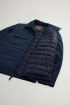 Cloud Overshirt Melton Blue, premium down filled overshirt, navy color, featuring two-way zipper and snap button pockets.