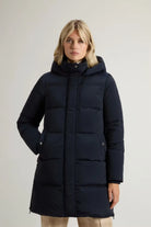 Kelly Jacket Melton Blue Coat displayed on model, featuring a stand-up collar and premium down fill.