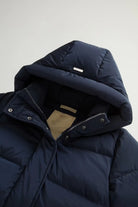 Kelly Jacket Melton Blue Coat, premium down filled coat with hood, windproof and water repellent, featuring snap buttons.