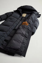 Kelly Long Parka Black Coat with removable hood and zippered side splits, showcasing premium down filling.