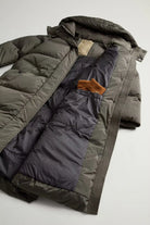 Kelly Long Parka Dark Green Coat interior view showcasing premium down filling and detailed stitching.