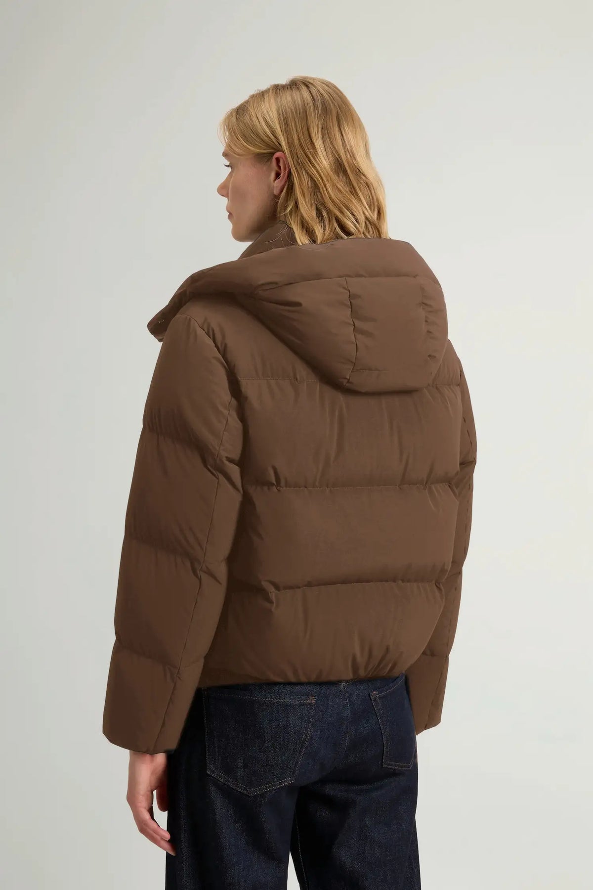 Madison Jacket Dark Earth Coat by Woolrich, back view showcasing its premium down fill and removable hood.