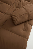 Madison Long Coat Dark Earth Coat by Woolrich, showcasing premium down filling and stylish design details.