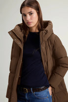 Woolrich Madison Long Coat Dark Earth Coat featuring a stylish stand-up collar and warm down filling.