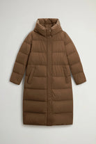 Madison Long Coat Dark Earth Coat by Woolrich, featuring a hood and premium down fill for cold weather protection.