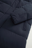 Madison Long Coat Melton Blue Coat by Woolrich, showing the padded sleeve and body in navy blue.