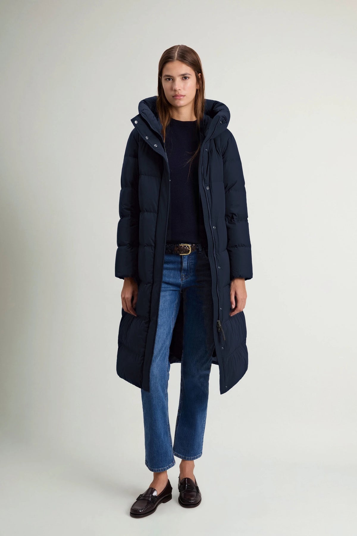 A model wearing the Woolrich Madison Long Coat Melton Blue Coat, showcasing its stylish and functional design.
