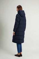 Woolrich Madison Long Coat Melton Blue Coat, a premium down filled coat viewed from the back.