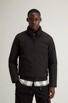 Model wearing the Cloud Lewis Bomber Black Coat, a stylish and practical down-filled jacket for transitional weather.