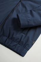 Close-up of the Cloud Lewis Bomber Melton Blue Coat showcasing the fabric and elastic hem details.