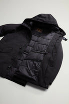 Stretch Parka Black Coat interior view showcasing premium padding and stylish design features.