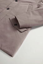 Stretch Parka Falcon Coat by Woolrich, showcasing premium light stretch fabric and buttoned flap pockets.