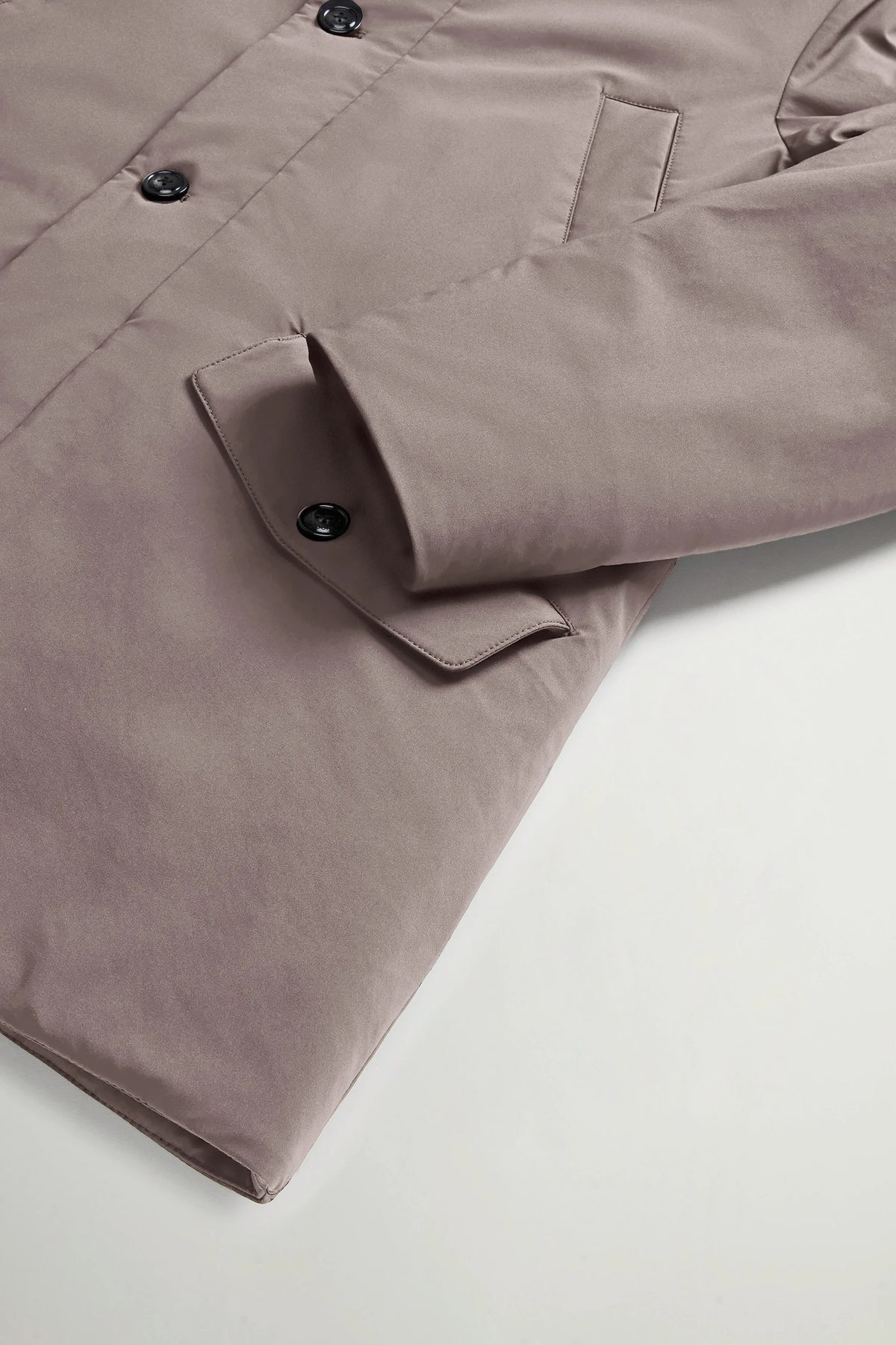 Stretch Parka Falcon Coat by Woolrich, showcasing premium light stretch fabric and buttoned flap pockets.
